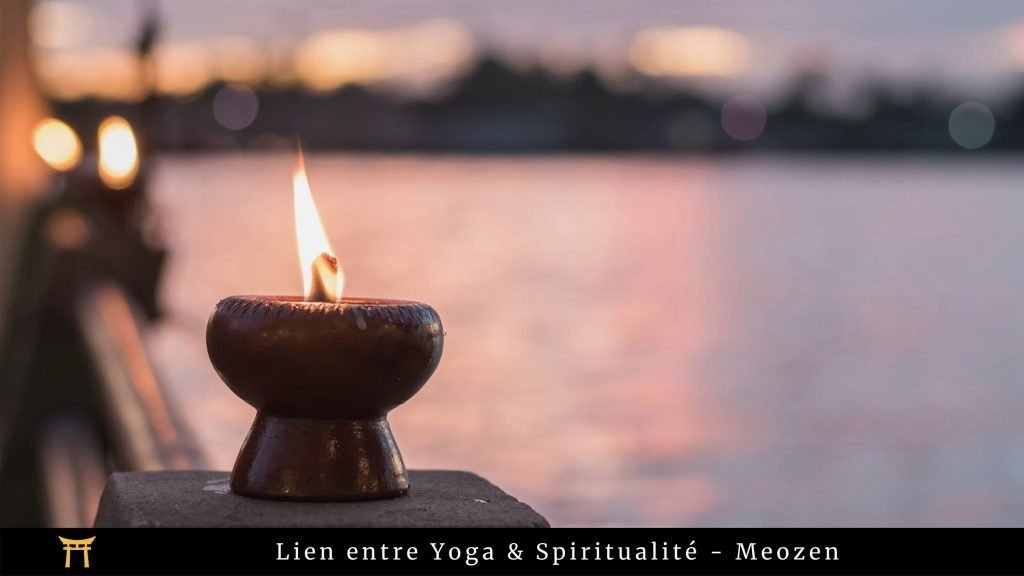 Image avec une bougie et l'indication "lien entre yoga et spiritualité"